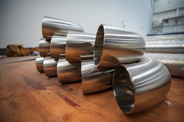 Stainless steel piping elbow component