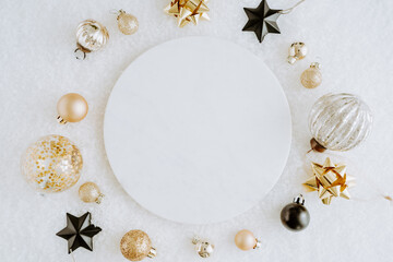 White marble cosmetic podium product design and Christmas golden and black decorations.