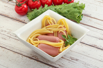 Mini sausages with pasta spaghetti