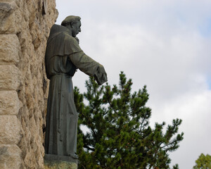 Naklejka premium Statue of Saint Anthony of Padua above the entrance of the church of Saint Anthony of Padua, Sveti Duh, Zagreb, Croatia