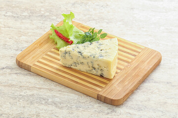Blue cheese piece over board