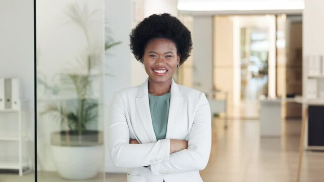 Confident, successful female entrepreneur or business manager at work. A happy lady office employee in charge. Portrait of female CEO standing folded arms, while smiling at camera.