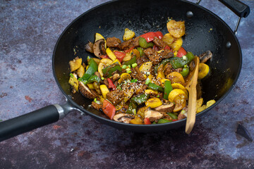 Vegan  meat and vegetables  stir fry in wok