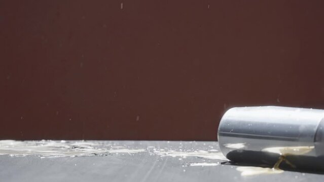 beer can exploding with a shot