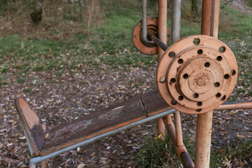 Iron barbell on an outdoor sports ground