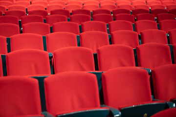 Fototapeta premium empty red velvet seats in movie theater