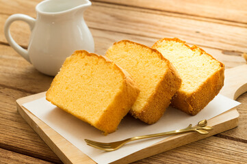 Slices of butter cakes with white  jar.