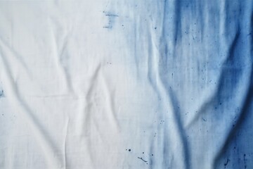 Blue ink stain on white cloth representing the need to wash and clean stains in everyday life