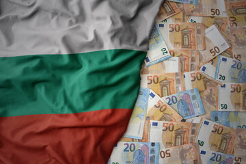 colorful waving national flag of bulgaria on a euro money background. finance concept
