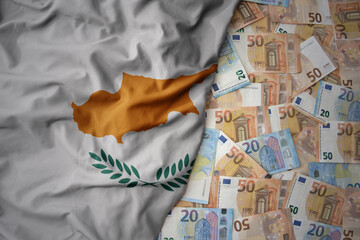 colorful waving national flag of cyprus on a euro money background. finance concept