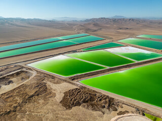 Aerial view of lithium fields / evaporation ponds in the Atacama desert, South America - a surreal,...