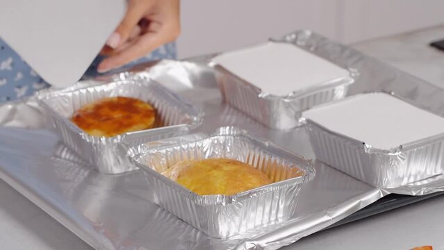 Opening the lid from aluminum food containers