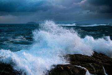 waves crashing on rocks