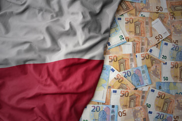 colorful waving national flag of poland on a euro money background. finance concept