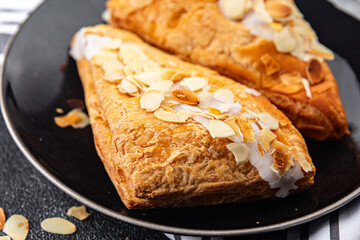 almond triangle cake cream puff pastry sweet dessert delicious healthy eating cooking appetizer meal food snack on the table copy space