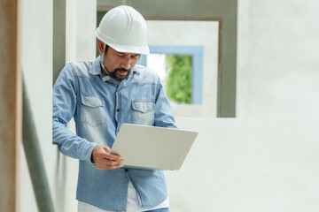 Manager architect designer worker engineer foreman Asian man Standing holding laptop he had tense...