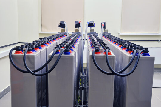 An industrial server room is equipped with a large UPS backup battery system to ensure uninterrupted power supply.