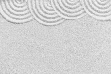 Fototapeta na wymiar Zen garden, Japanese garden with art line pattern on white sand background,Top Beach Sand Nature texture curve surface,Background Banner for Buddhism Meditation, Harmony,Calm,Feng Shui,Zen like