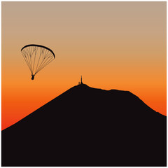 Puy de dome volcano  paraglider silhouette at sunset © Megane Ad