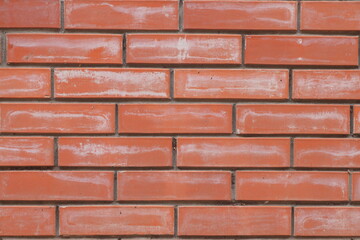 brick red wall. background of a old brick house. Red brick wall texture background. Close up of red brick wall.