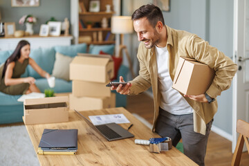 Small business owner packing in the cardbox at workplace