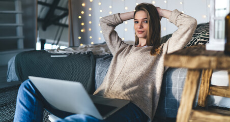 Serious woman working on project on laptop