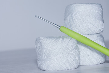cotton yarn for knitting lace and crochet hook. - obrazy, fototapety, plakaty