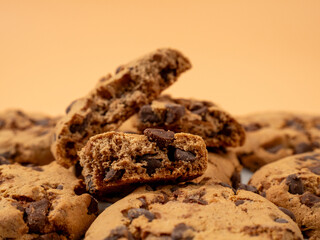 Oatmeal cookies with chocolate chips on an orange background. Classic oatmeal cookies with chocolate.