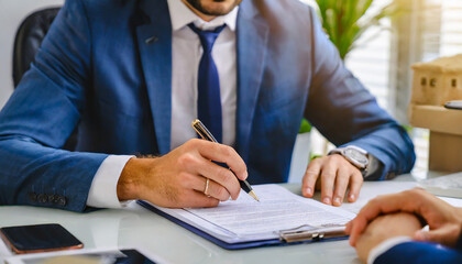 selective focus on hands Businessman signing contract, mortgage or investment professional document agreement