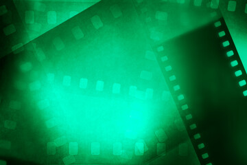 Obraz premium Film negatives green background