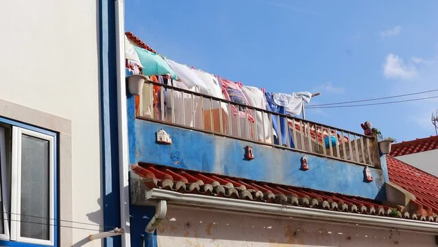 Wet clothes dry on a clothesline in the wind