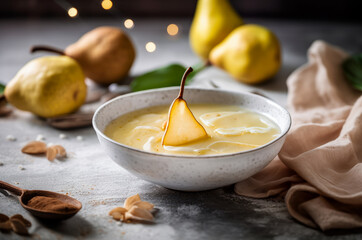 Bowl of Creamy Pear Soup topped with pear slice and swirls of cream. Horizontal, side view.