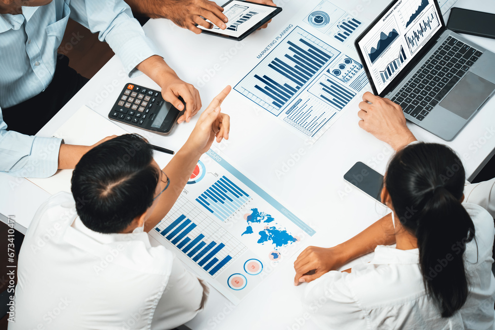 Leinwandbilder Analyst team utilizing BI Fintech to analyze financial data at table in meeting room. Businesspeople analyzing BI dashboard power on paper for business insight and strategic marketing planning.Prudent