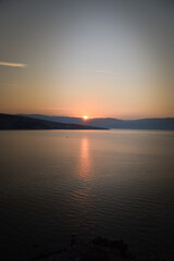 sunrise over the sea, clear sky without clouds. golden hour.	
