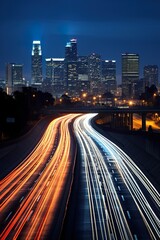 Obraz premium big city skyline and traffic lights blurred motion, skyscrapers and highway light trails at rush hour