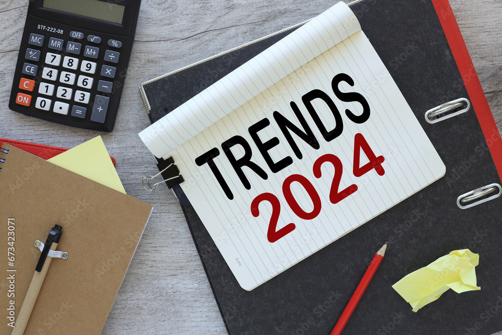 Poster trends 2024 text on notepad page. view from above