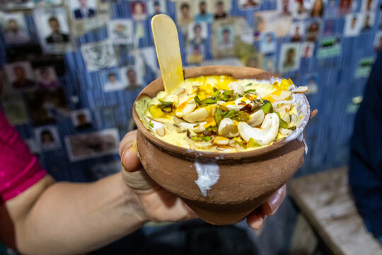 Banana and chocolate lassy in a clay pot, a typical dairy drink in India. of different flavors.