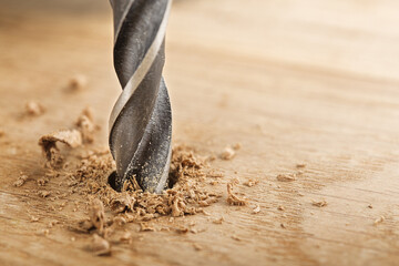 metal drill bit make holes in wooden oaks plank