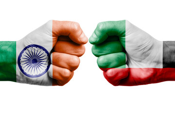 INDIA vs UAE confrontation, religious conflict. Men's fists with painted flags of INDIA and UAE.