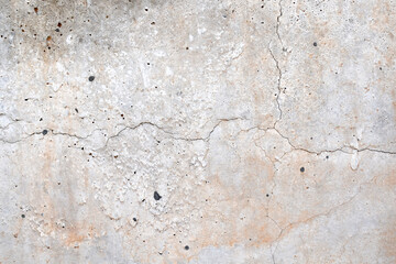 Dirty old cracked concrete wall texture background. Old rough and grunge texture wall. Texture of cement wall with black mold and stains. Abandoned building construction.