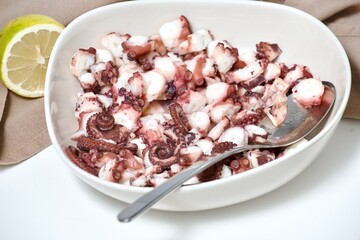 octopus in salad with olive oil and lemom