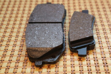 New brake pads for a passenger car. Front and rear brake pads.