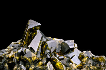 epidote crystals isolated on black background. macro detail close-up rough raw unpolished semi-precious gemstone