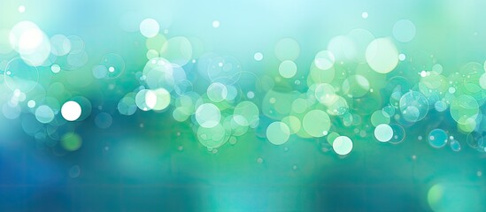 Digital illustration of an abstract background in shades of light blue and green featuring bokeh...