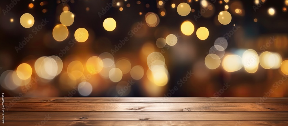 Poster the table in front of a blurry background at a restaurant is made of dark wood and is empty it can b