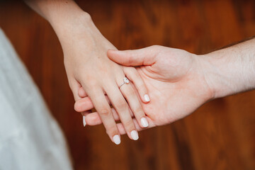 close up of a hands holding a ring