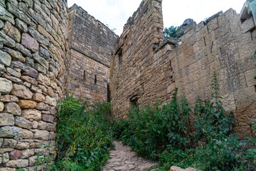 Dagestan Gamsutl. Ancient ghost town of Gamsutl old stone houses in abandoned Gamsutl mountain village in Dagestan, Abandoned etnic aul, summer landscape.