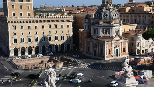 traffic in the centre of Rome, Italy. Piazza Venezia, view from Vittoriano (The Altare della Patria). Panorama of Rome. Italian flags. Statue of Victor Emmanuel II