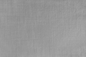 Texture background of gray linen fabric, cloth surface, weaving of natural cotton fabric