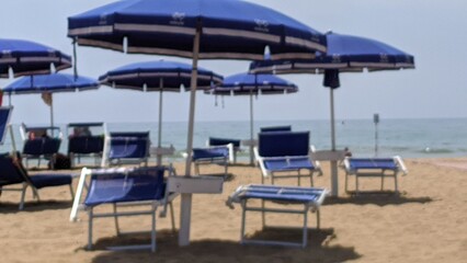 Fototapeta na wymiar beach chairs and umbrellas